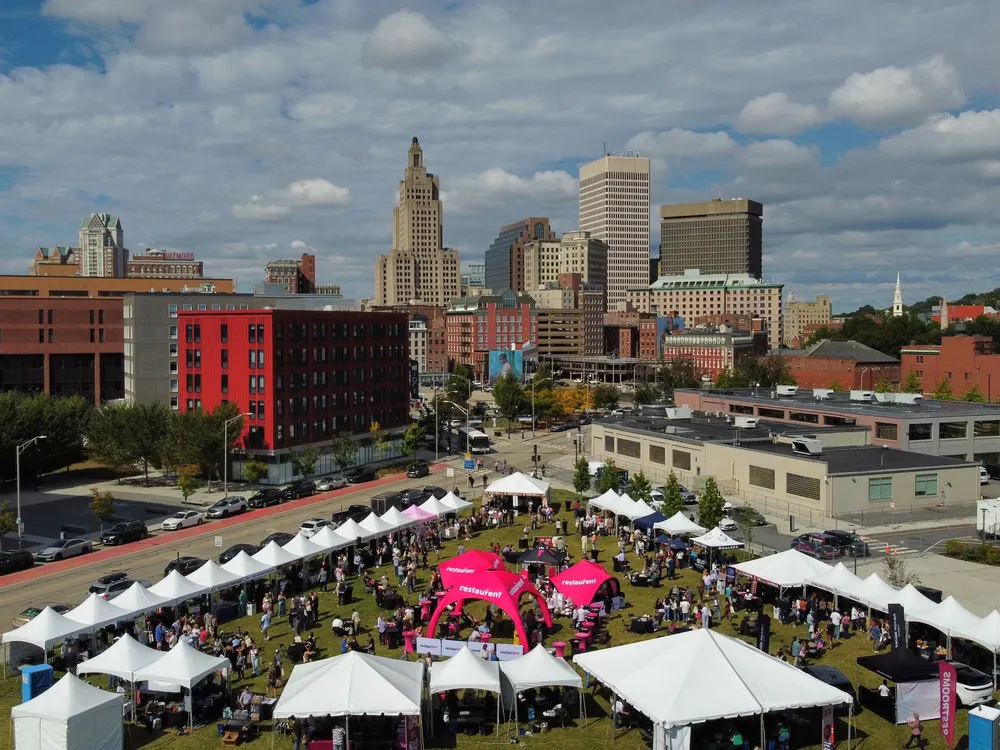 Aerial view of a RestauRent outdoor event with tents in downtown Providence
